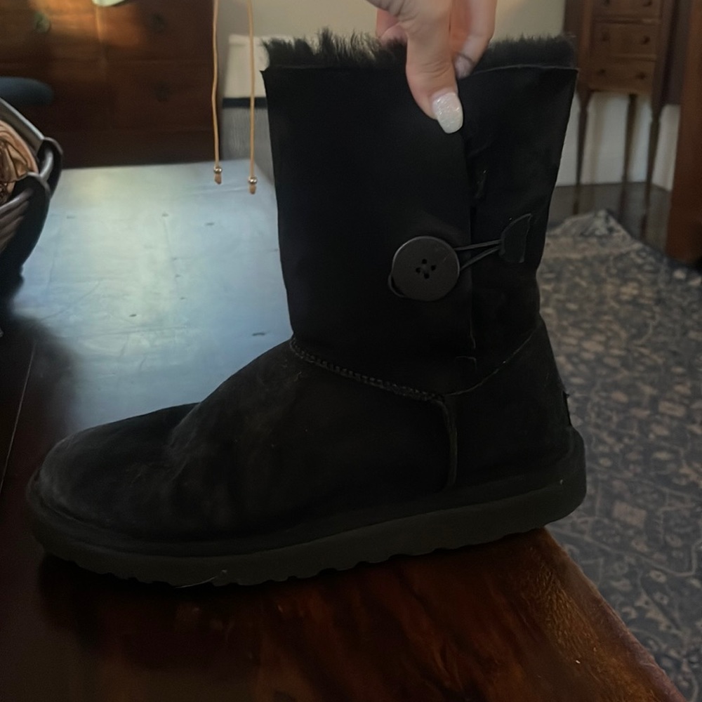 Woman’s black ugg boot